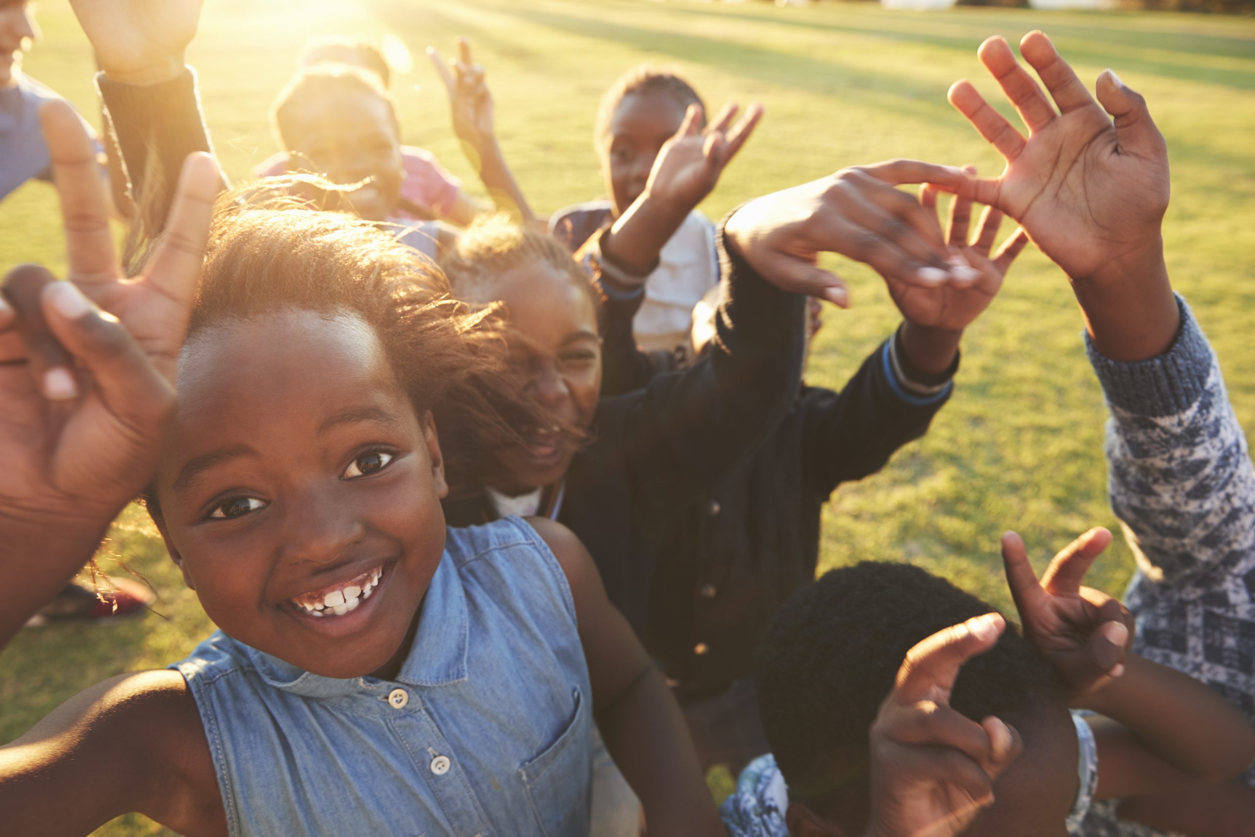 Elementary school kids outdoors, high angle, lens flare